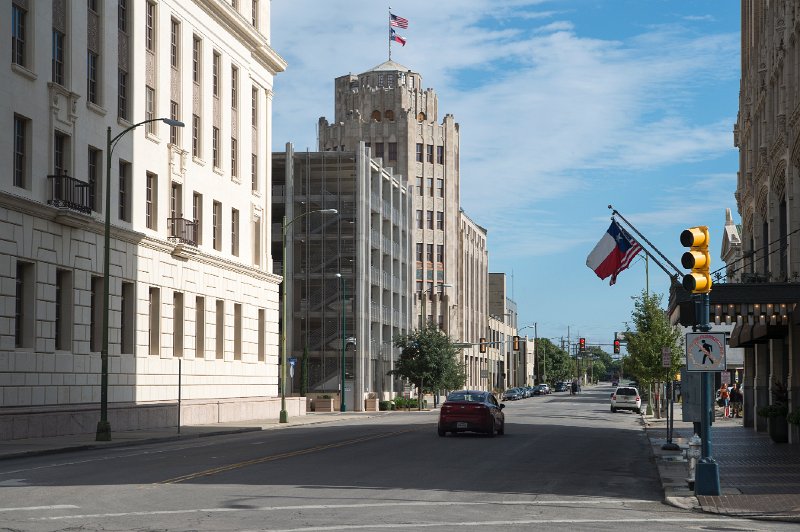 20151031_114600 D4S.jpg - The San Antonio Express Building (with flags) and Emily Morgan Building on right